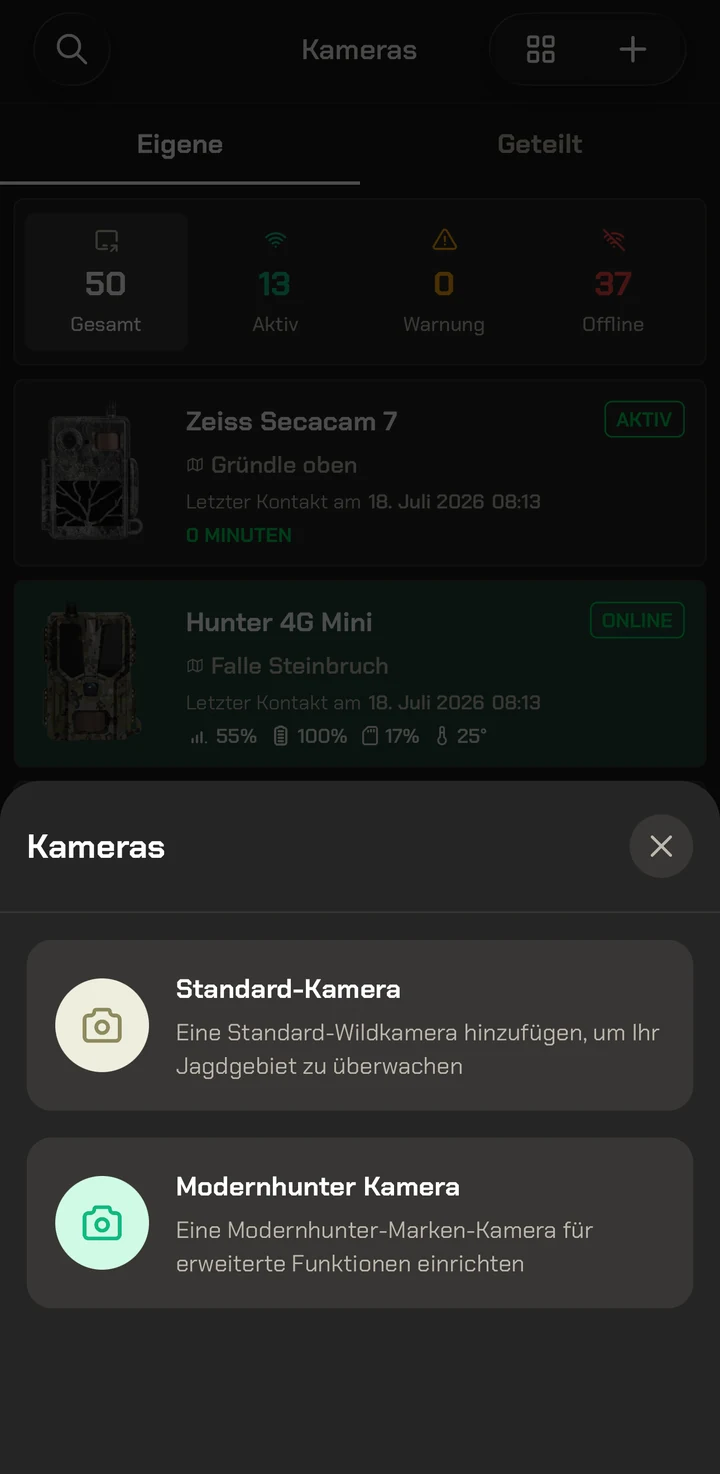 Aplikacja Modernhunter: przegląd kamer z otwartym menu wyboru „Kamera standardowa” i „Kamera Modernhunter”